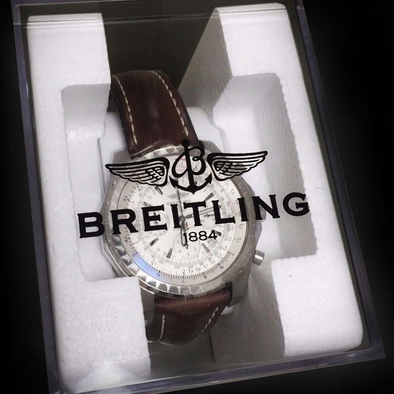 watch in a clear plastic box